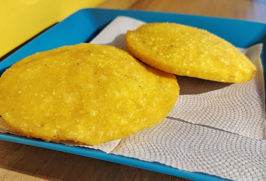 https://delamesa.com/wp-content/uploads/2022/09/Arepa-de-Huevo-de-La-Mesa-Food-Tours-1024x696.jpeg