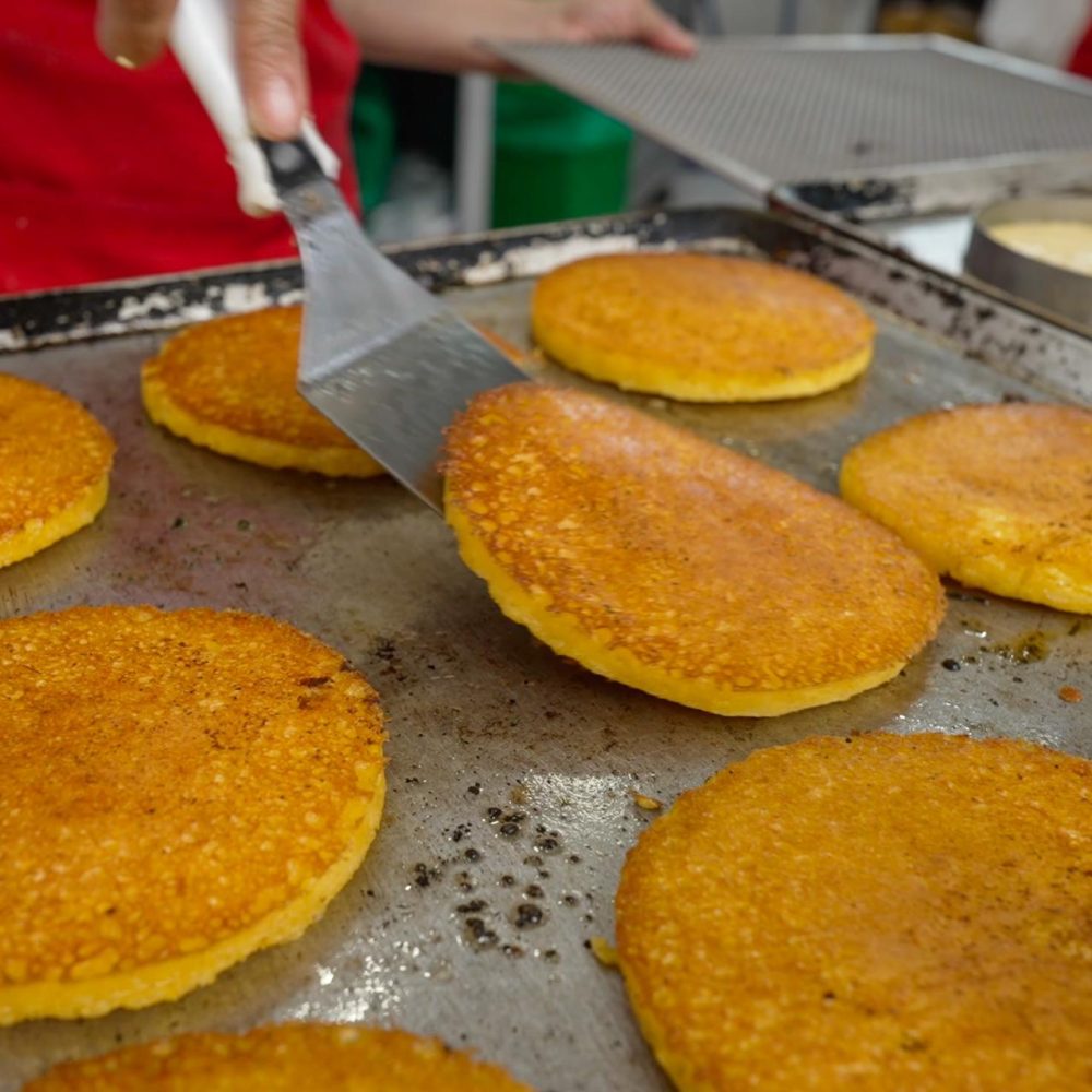 Arepa de chocolo Medellin Street Food Tour